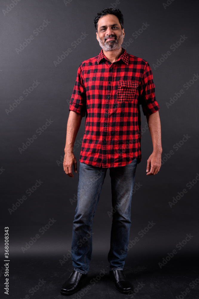 Portrait of mature bearded Indian hipster man Portrait of mature bearded Indian hipster man