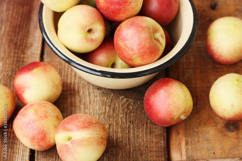 Juicy nectarines on a wooden table macro Juicy nectarines on a wooden table macro