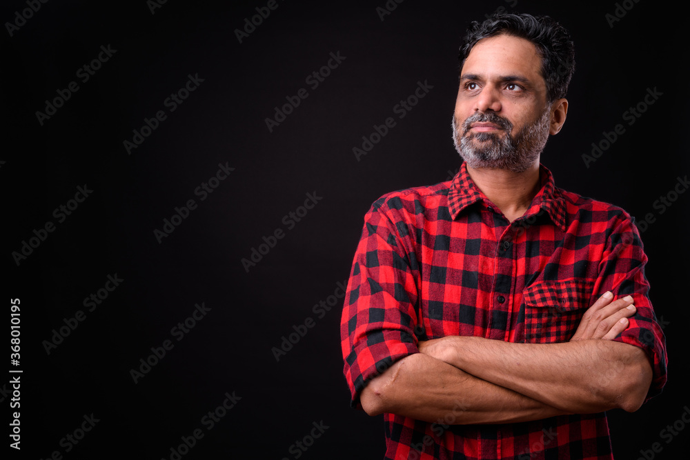 Portrait of mature bearded Indian hipster man