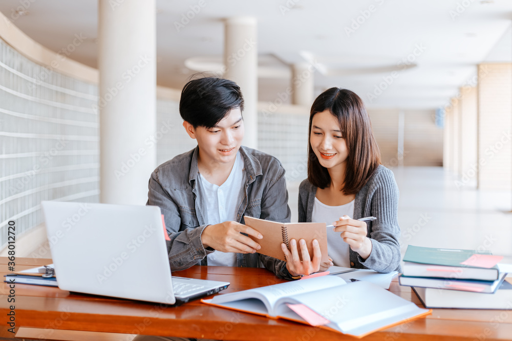 High school or college students group catching up workbook and learning tutoring on desk and reading, doing homework, lesson practice preparing exam. High school or college students group catching up workbook and learning tutoring on desk and reading, doing homework, lesson practice preparing exam.