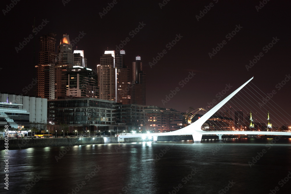 Fototapeta premium View of The Waterfront with Women's Bridge at night in Buenos Aires, Argentina