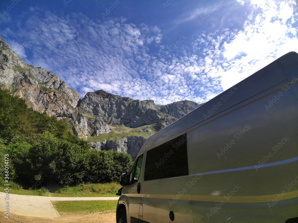 Summer in the high mountains. Traveling with a camper van