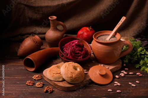 lobio in a pot, with mchadi , a traditional Geogian dish, horizontal, rustic  photo