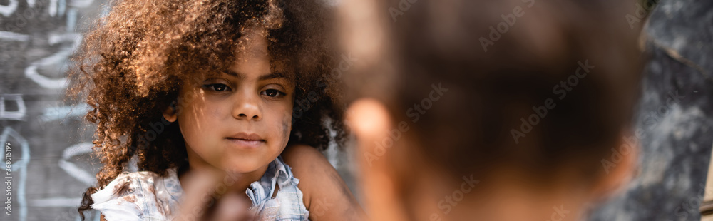 horizontal crop of curly and poor african american kid near brother