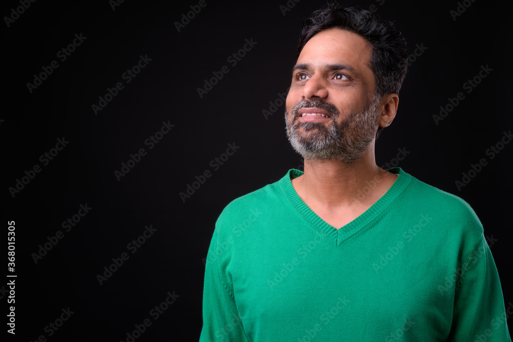 Portrait of mature bearded Indian man with curly hair Portrait of mature bearded Indian man with curly hair