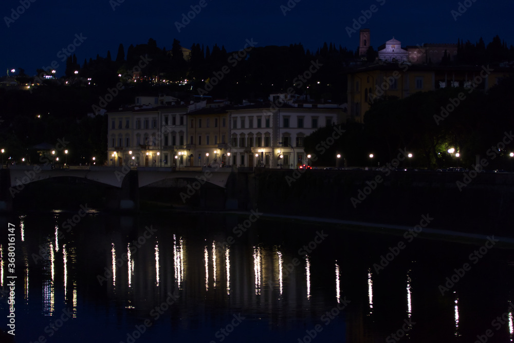 The night lights on the Arno River in Florence