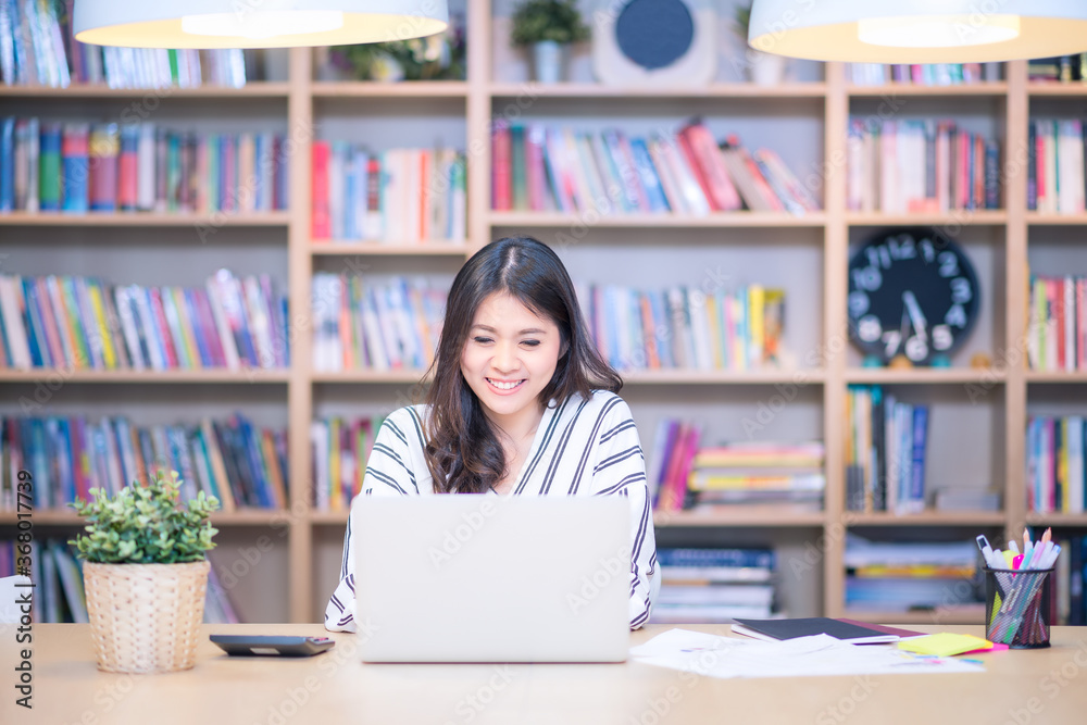 Young business freelancer smiling while chat with her marketing team at Co Working Space office.Conceptual for startup small businesses entrepreneur and freelance. Young business freelancer smiling while chat with her marketing team at Co Working Space office.Conceptual for startup small businesses entrepreneur and freelance.