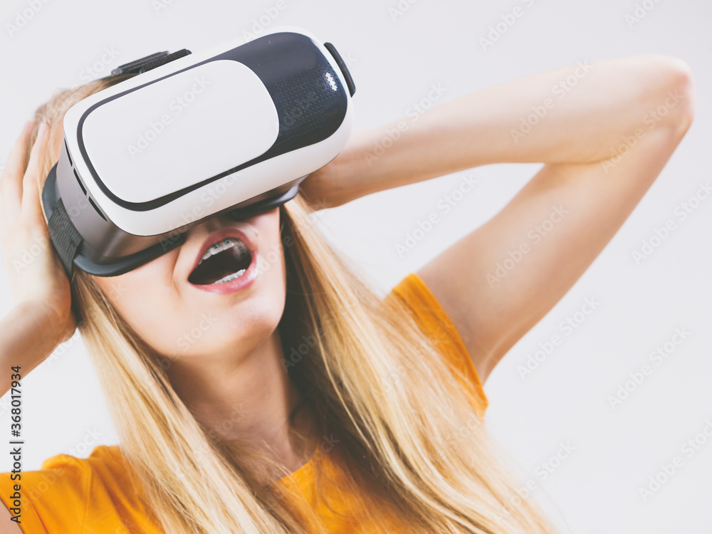 Fototapeta premium Girl wearing virtual reality goggles.