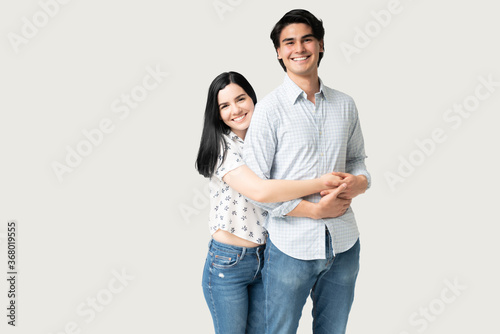 Smiling Latin Young Couple In Casuals