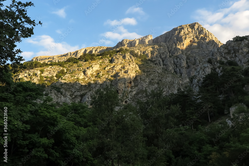 Mountain top illuminated with sunset in park of the Commune of Celano, Abruzzo region, L'aquila province, Italy
