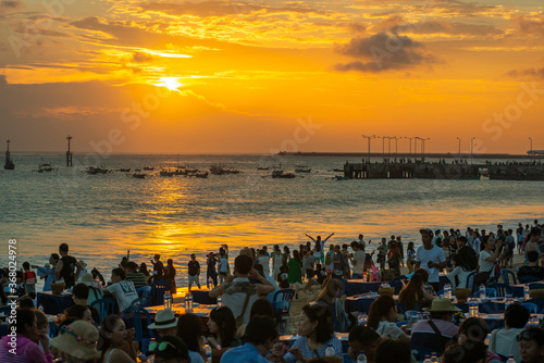 Sunset time at Jimbaran Bay in the Island of Bali, Indonesia, before Pandemic. 