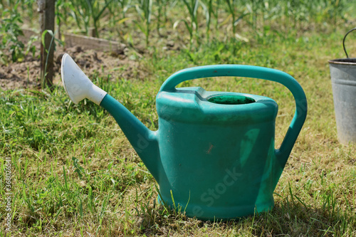old green watering can