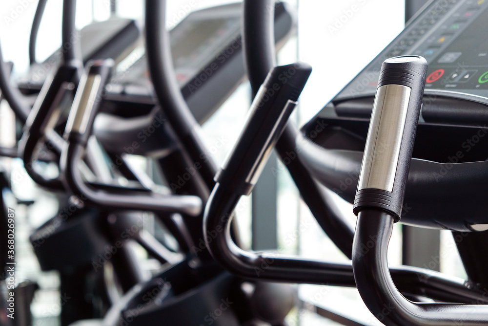 Detail image of Treadmill in fitness room background 