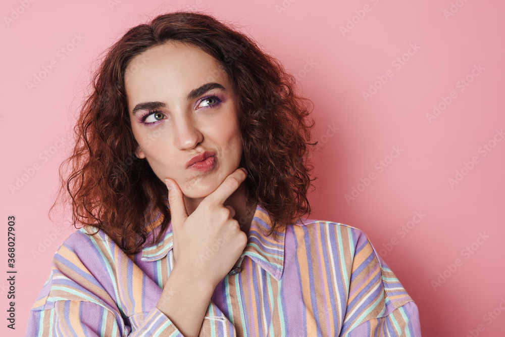 Image of redhead brooding woman thinking and looking aside Image of redhead brooding woman thinking and looking aside