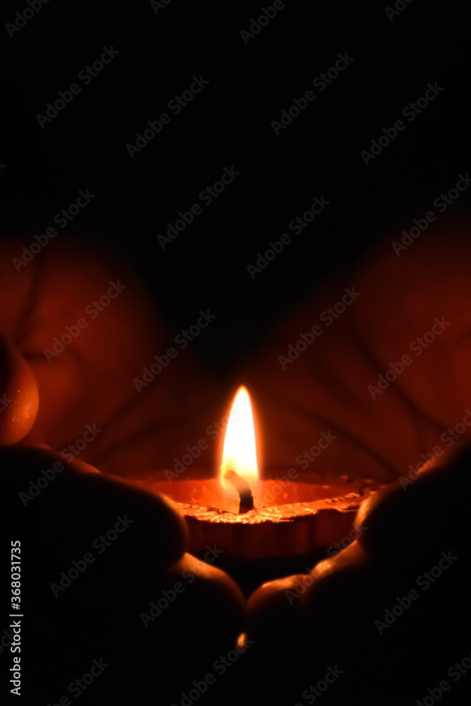 A candle is an ignitable wick embedded in wax, or another flammable solid substance such as tallow, that provides light, and in some cases, a fragrance. 