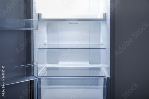 Empty open fridge interior