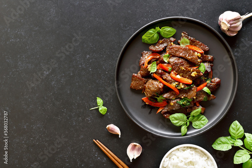 Wallpaper Mural Thai beef stir-fry with pepper and basil on plate