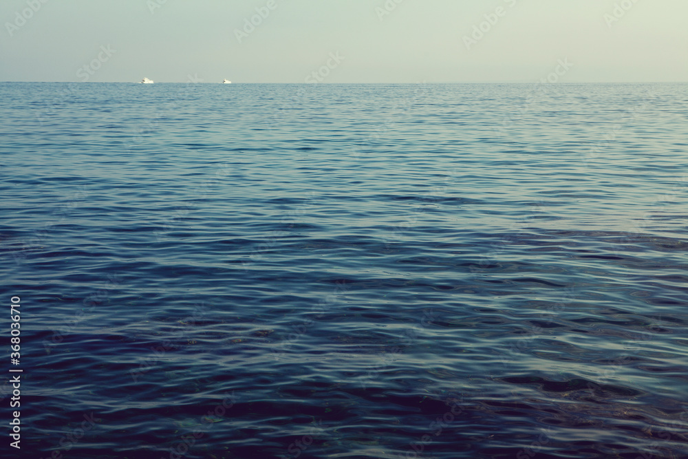 Obraz premium sea background with two shipsin the distance in summer day
