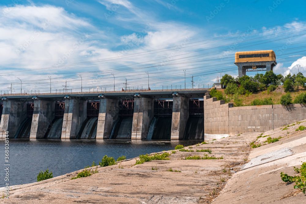 Togliatti? Russia - 19 July 2020. The dam of the Volga hydroelectric power station without water discharge. Electricity, road.