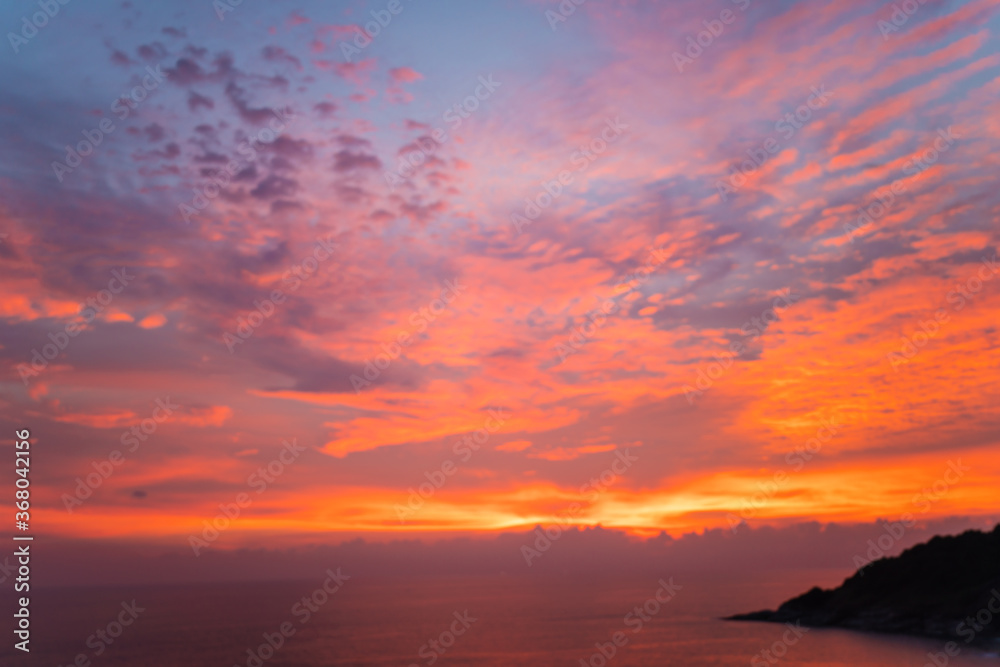 Colourful sunset sky on seashore beach wave Phuket