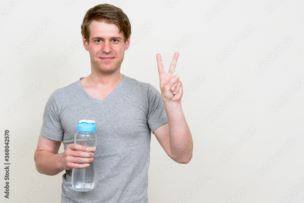 Portrait of young handsome man ready for gym Portrait of young handsome man ready for gym