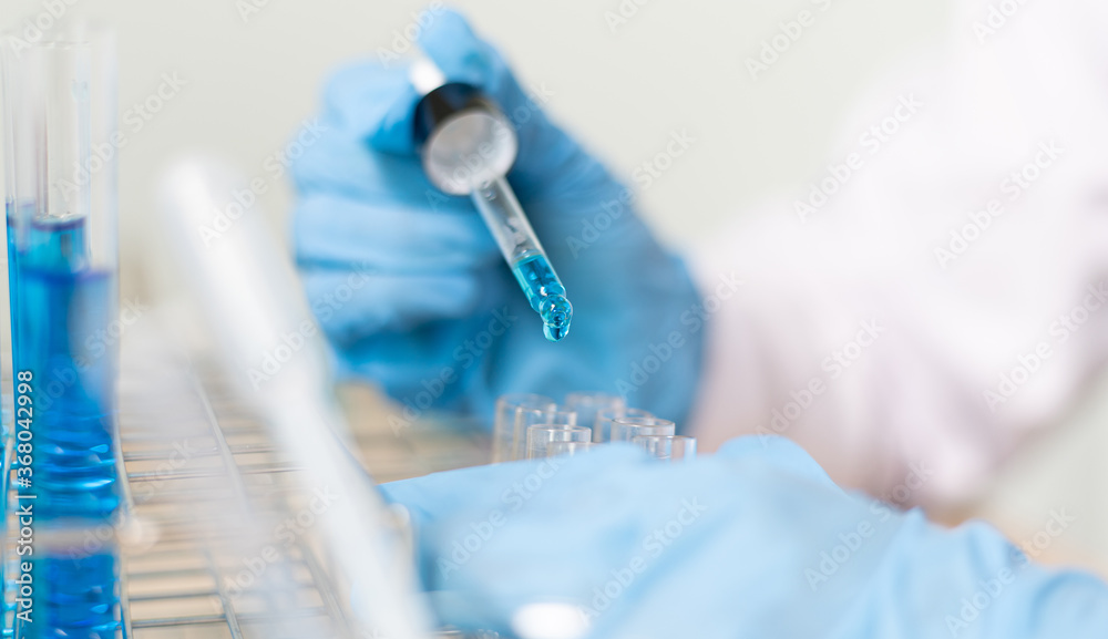 Doctor is testing a vaccine against the virus in the lab. Doctor is testing a vaccine against the virus in the lab.