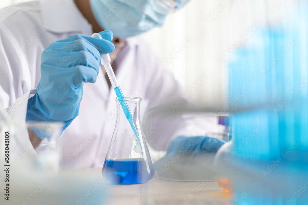 Doctor is testing a vaccine against the virus in the lab. Doctor is testing a vaccine against the virus in the lab.