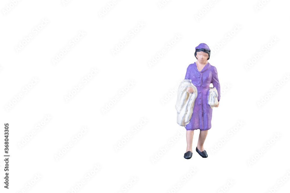 Close up of Miniature people isolated with clipping path on white background. Close up of Miniature people isolated with clipping path on white background.