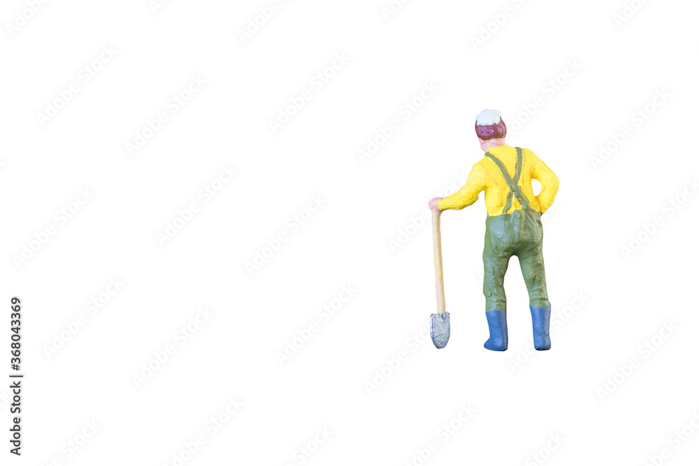 Close up of Miniature farmer people isolated with clipping path on white background . Elegant Design with copy space for placement your text, mock up for farmer and gradening concept