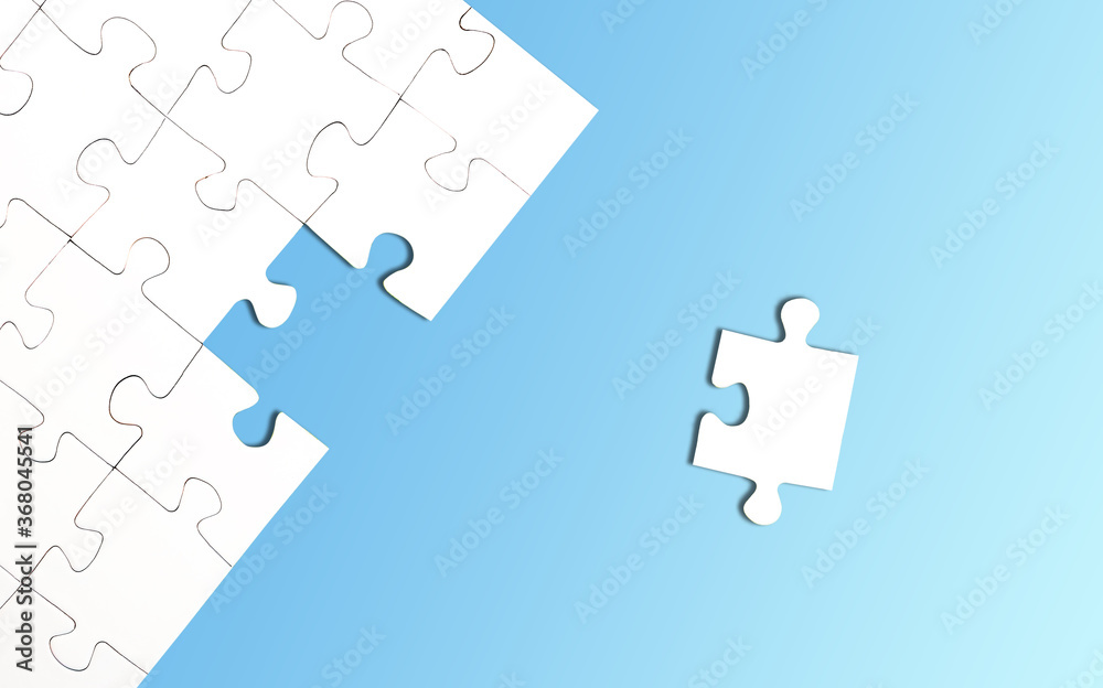 top view of incomplete jigsaw puzzle with one piece left on bright blue background, completing a task or solving a problem concept top view of incomplete jigsaw puzzle with one piece left on bright blue background, completing a task or solving a problem concept