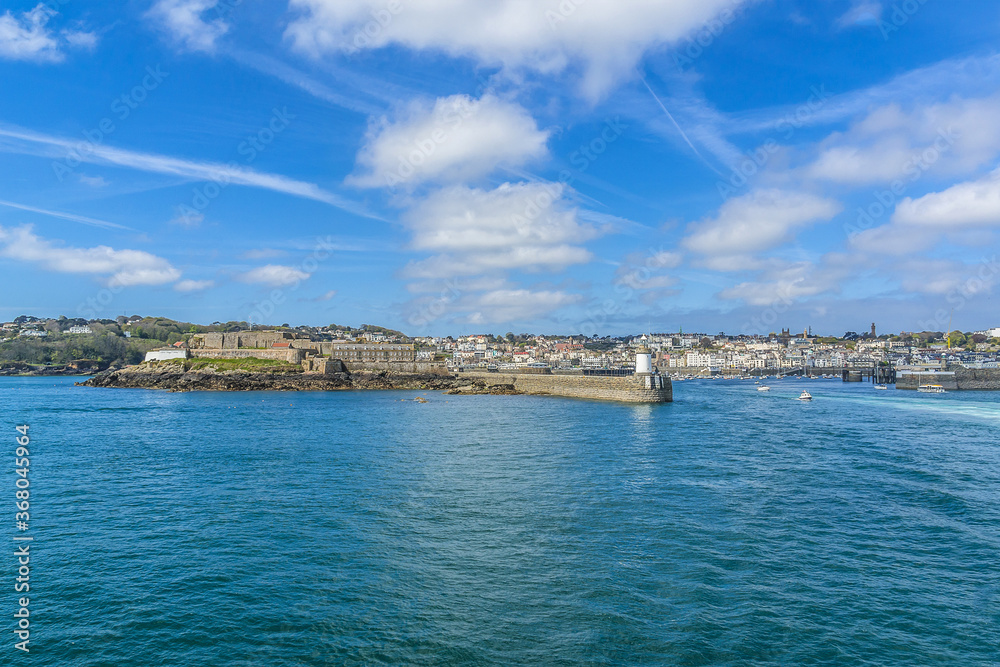 View from sea of Castle Cornet. Castle Cornet has guarded Saint Peter Port for 800 years. Saint Peter Port - capital of Guernsey, British Crown dependency in English Channel off coast of Normandy.