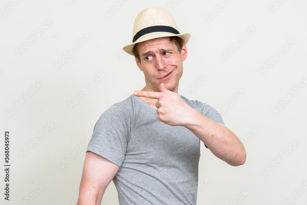 Portrait of young handsome tourist man ready for vacation Portrait of young handsome tourist man ready for vacation