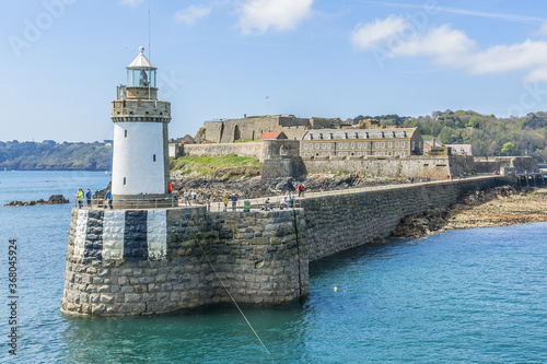 View from sea of Castle Cornet. Castle Cornet has guarded Saint Peter Port for 800 years. Saint Peter Port - capital of Guernsey, British Crown dependency in English Channel off coast of Normandy.