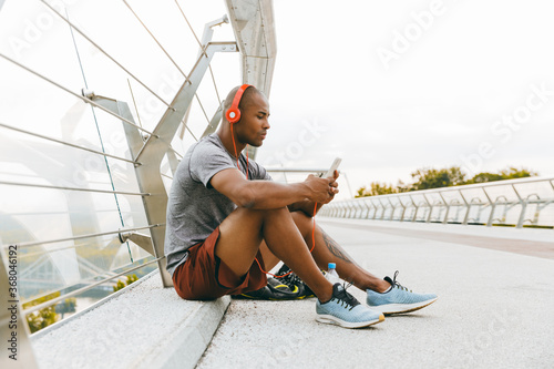 African american athlete man listening to the music