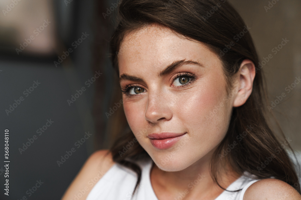 Image of beautiful caucasian woman posing and looking at camera Image of beautiful caucasian woman posing and looking at camera