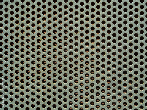 Photo close-up of gray perforated metal
