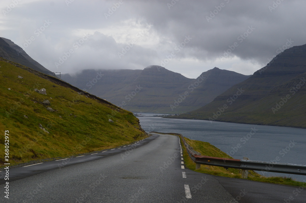 The stunning and dramatic coast and mountains on the Faroe Islands The stunning and dramatic coast and mountains on the Faroe Islands
