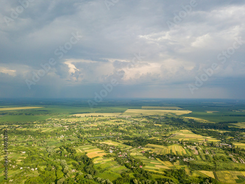 Aerial drone view. Agricultural fields near a village in Ukraine. © Sergey