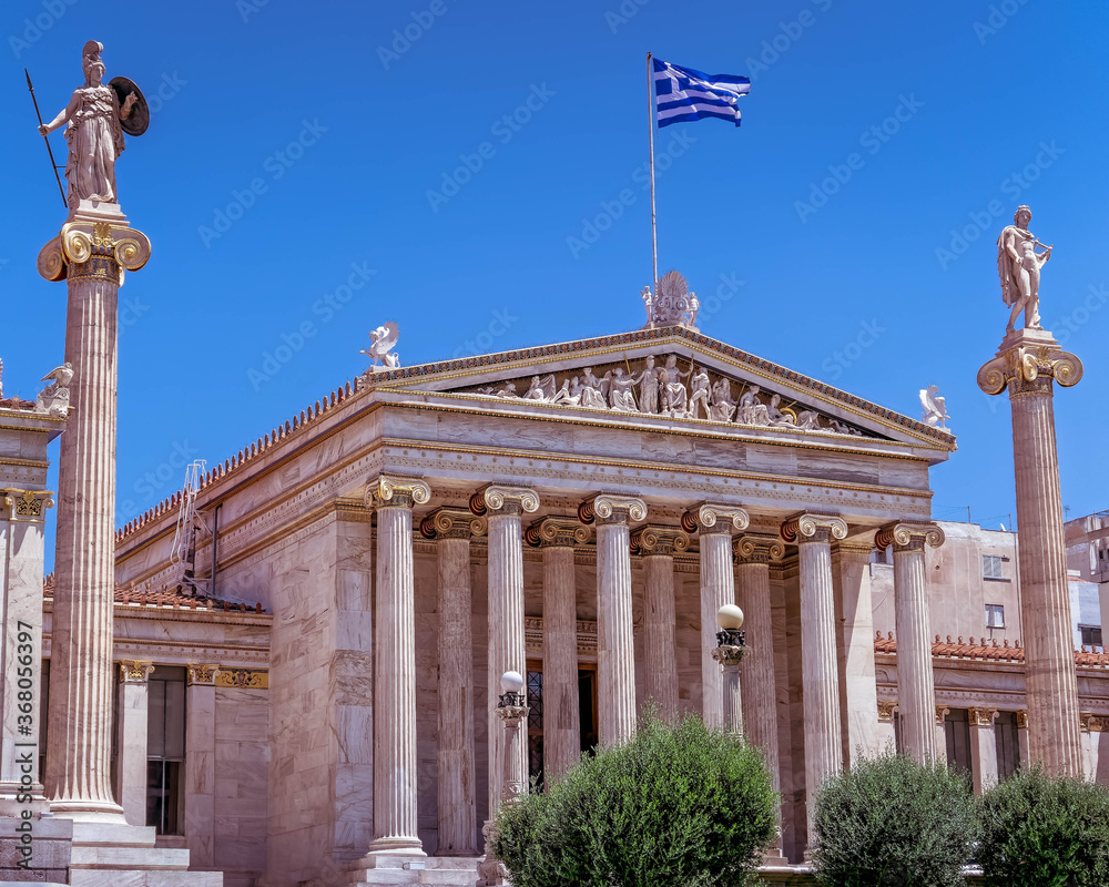 Athens Greece, the national academy lassical building white marble facadewith Athena and Apollo statues