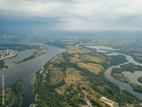 Aerial view of the Dnieper River and the city of Kiev from above. Summer sunny day.