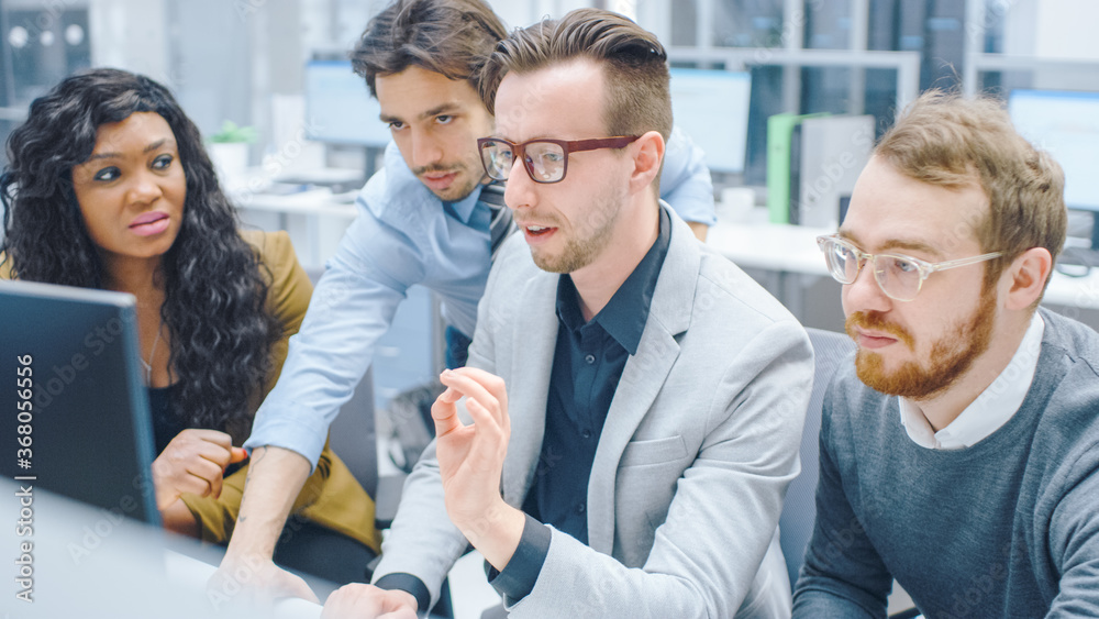 Fototapeta premium In Modern Office: Diverse Team of Young Motivated Businessmen and Businesswoman Work on Computer, Having Discussion, Finding Problem Solution Collectively. Ambitious Businesspeople Collaboration