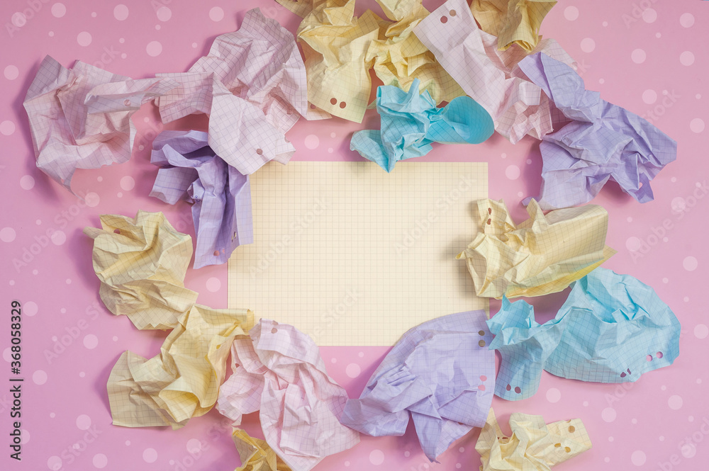 composition of crumpled paper in pink, yellow, blue and purple colors on a bright background composition of crumpled paper in pink, yellow, blue and purple colors on a bright background