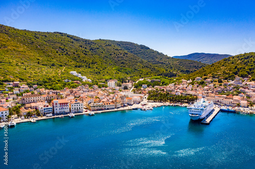 VIS, VIS ISLAND, CROATIA Aerial view of the city and port with passenger ferry which connects Split and Vis
