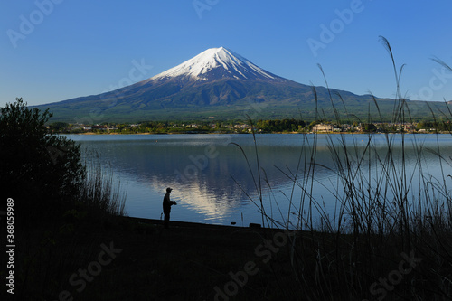 Fuji mountain and reflection on the lake in morning.