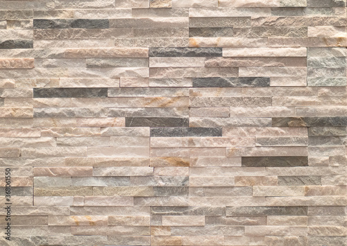 facing made with small rectangular stone tiles of non-uniform color