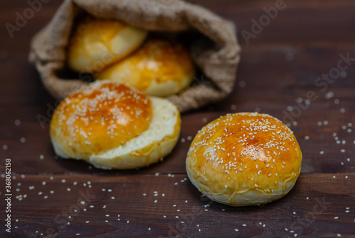 Fresh homemade burger buns with sesame.