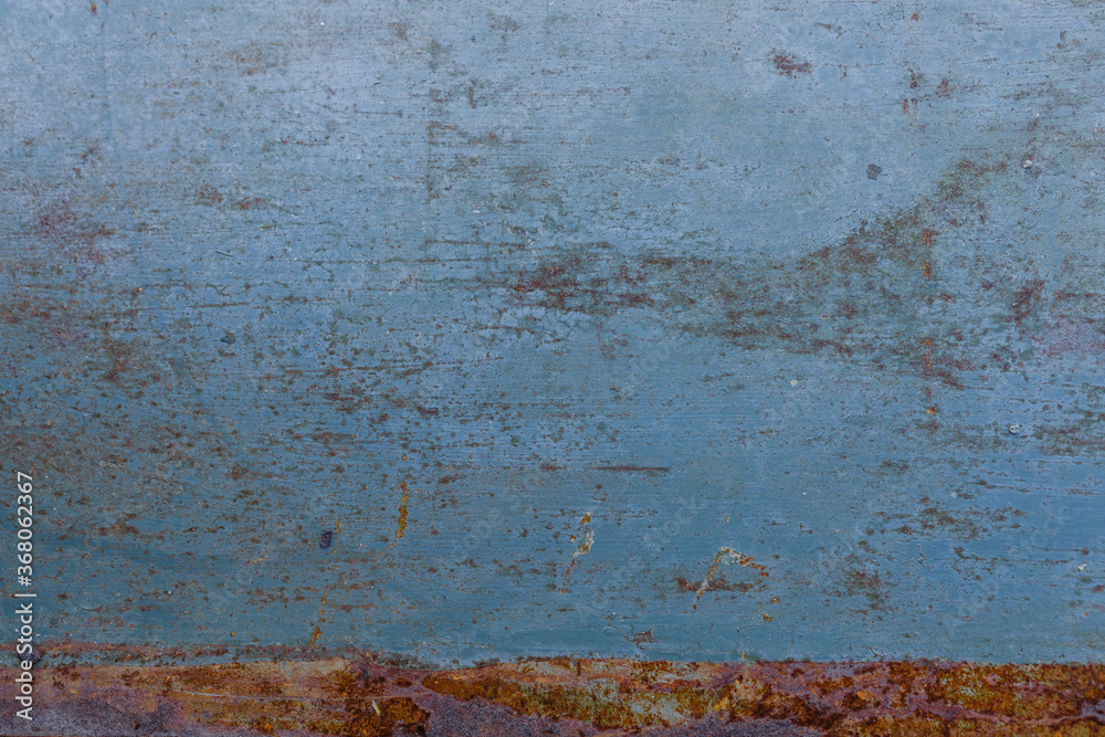 Old metal sheet with blue paint and rust for background