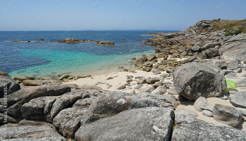 Beach with sand and rocks on the coast of Galicia, Spain, Atlantic ocean, Bueu, province of Pontevedra, Praia de Lagos