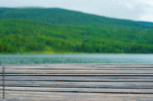 Beautiful scenery with wooden path  blue lake and big mountains