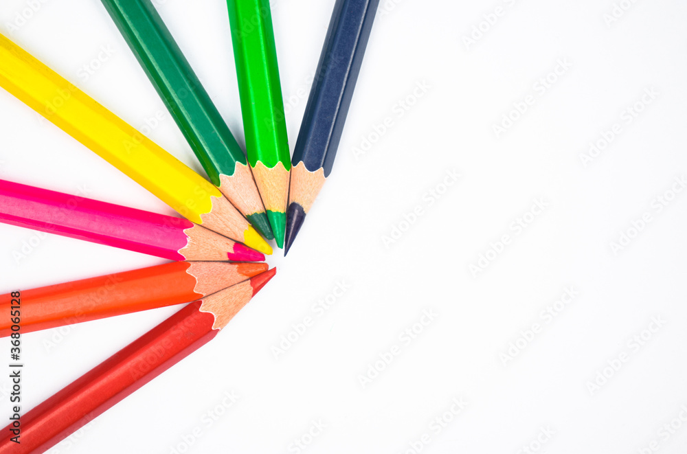 Pattern made with seven different colored wood pencil crayons on a paper Pattern made with seven different colored wood pencil crayons on a paper